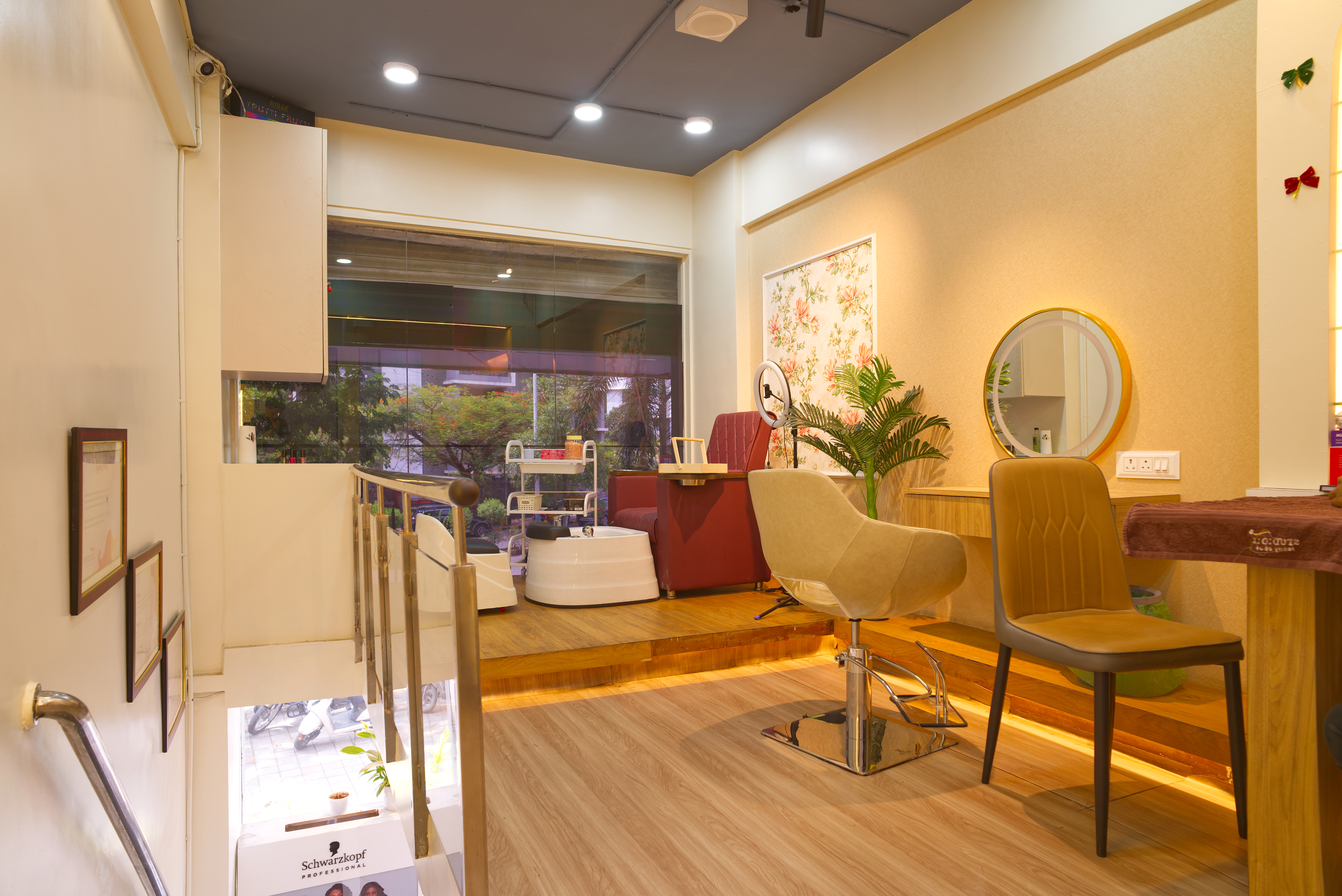 Apricot Salon — Upper floor with floral wall and styling chair