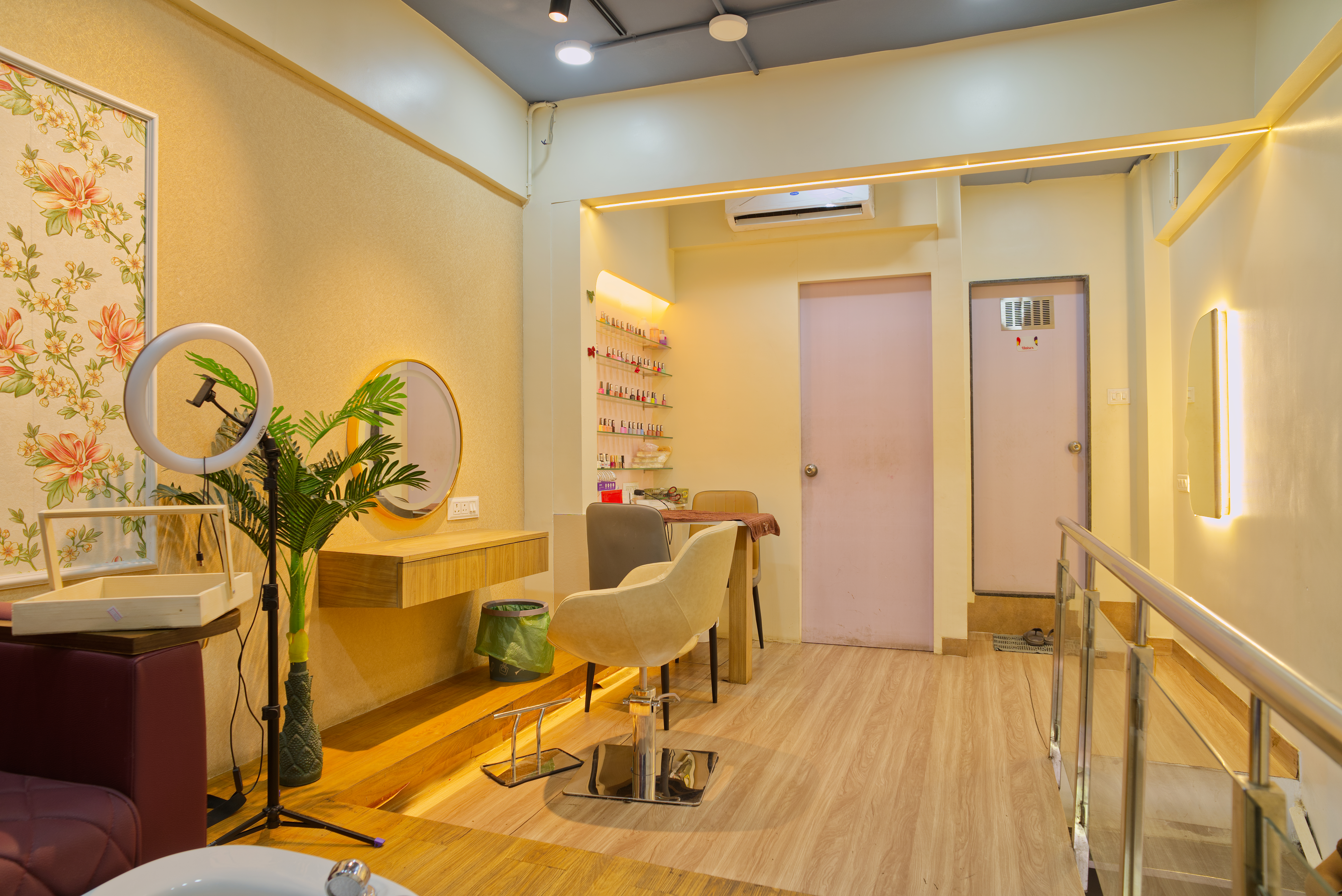 Apricot Salon — Upper floor styling area with round gold mirror